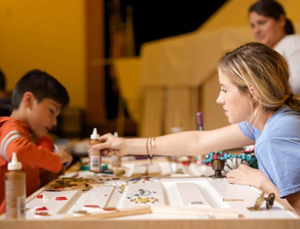 children sitting at craft table